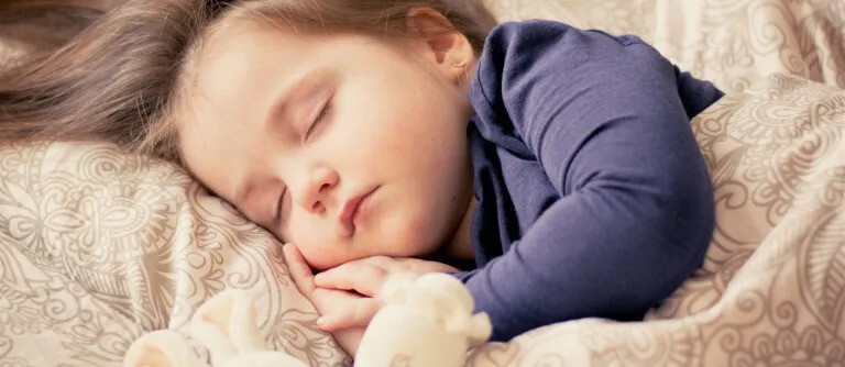 An infant sleeping peacefully.