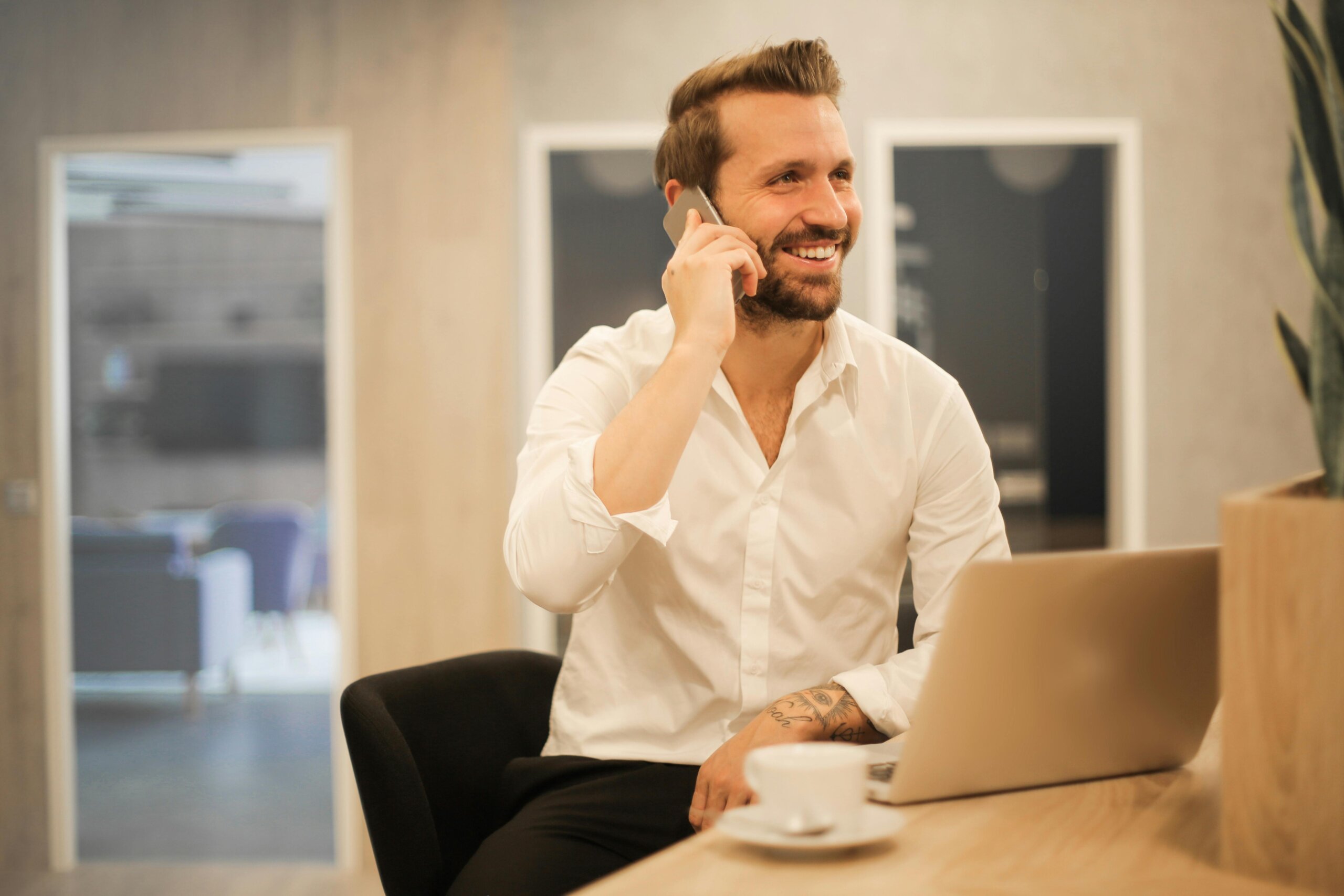 A man on his phone having as telehealth counseling session