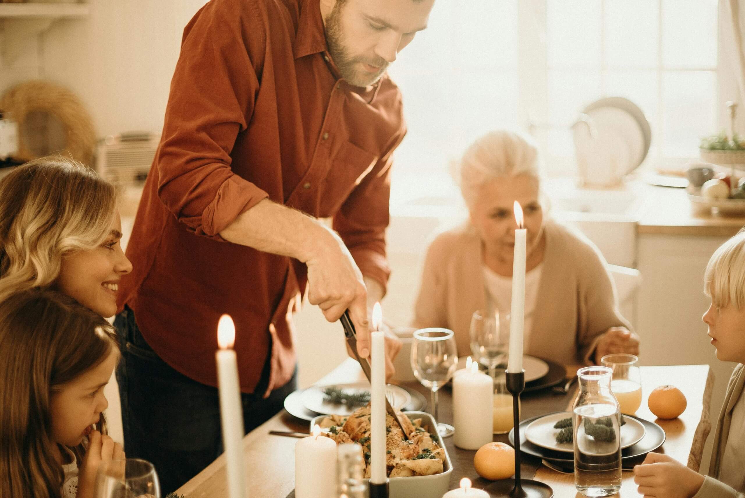 Family sitting around the table at the holidays