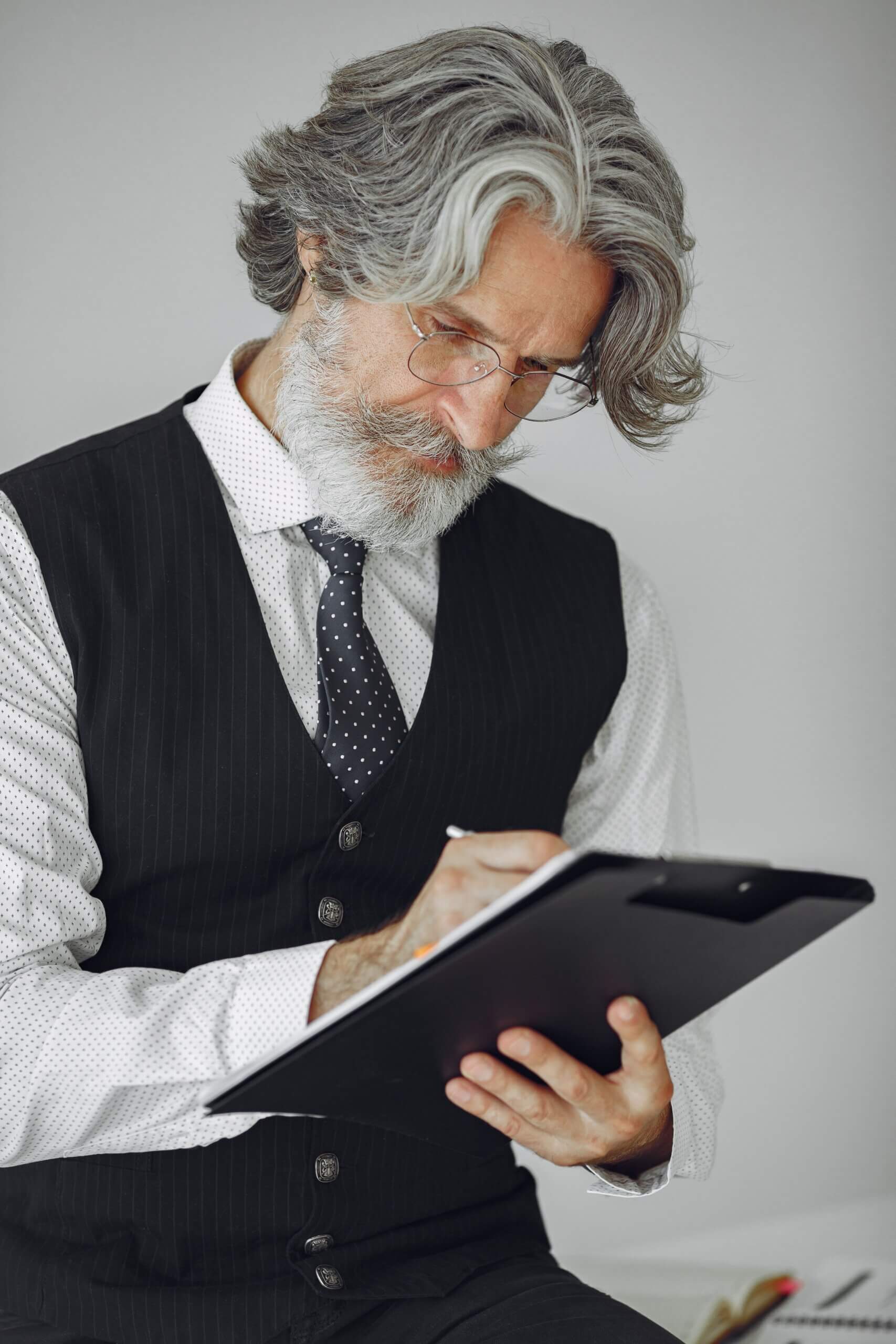 A professional man staring at his notes.
